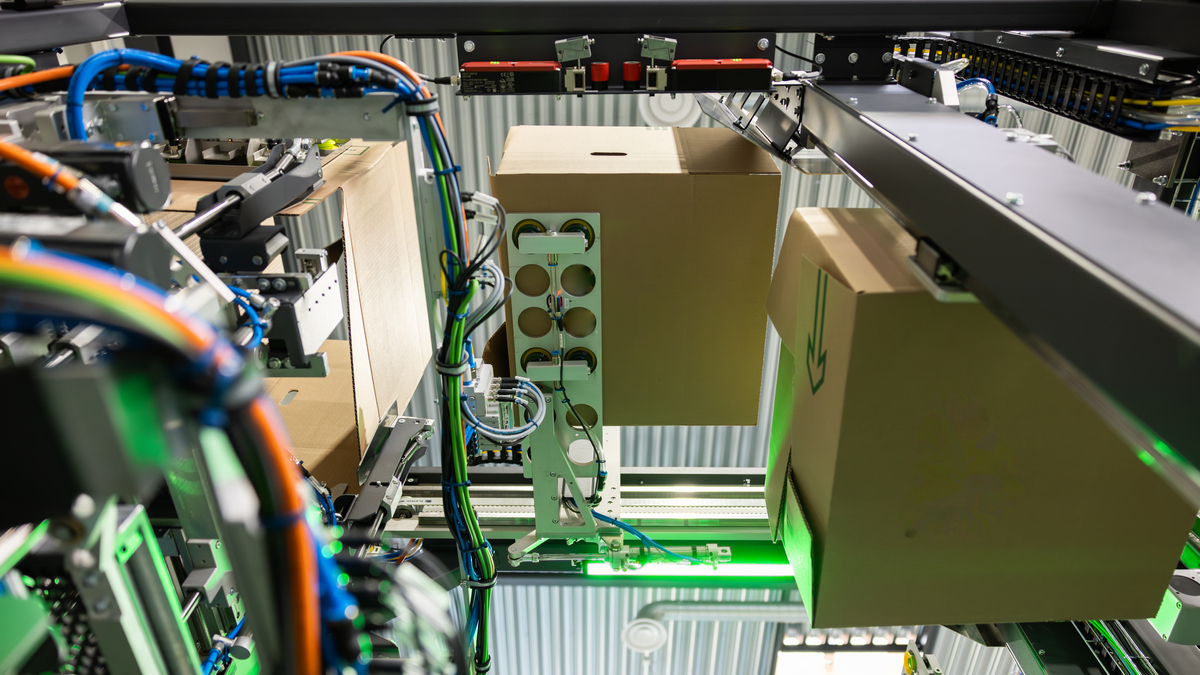 Internal view of Tronrud packing machine, wihg cases and wiring.